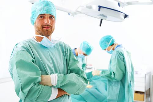 Surgeon posing for a picture after a successful operation (Photo Credit via actifit.info) 