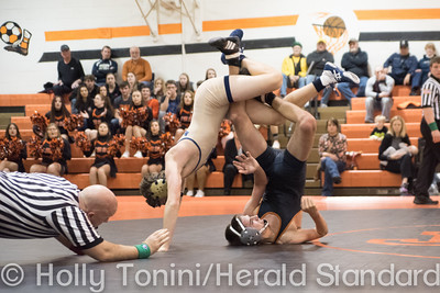 Jefferson-Morgans Josh Agnew and McGuffys Gage Nicoella flip on the mat during a match at Jefferson-Morgan