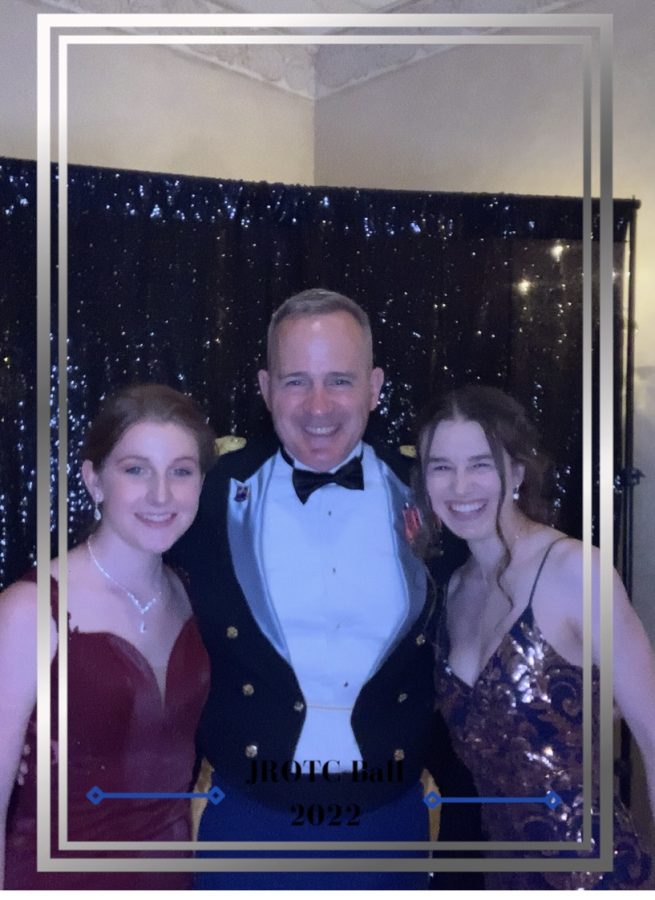 Zoey Stull Brook Ann Maddich and their Colonel (commander) smiling pretty at military ball